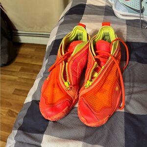 Jordan Red and Yellow Athletic Shoes with Streamlined Silhouette
